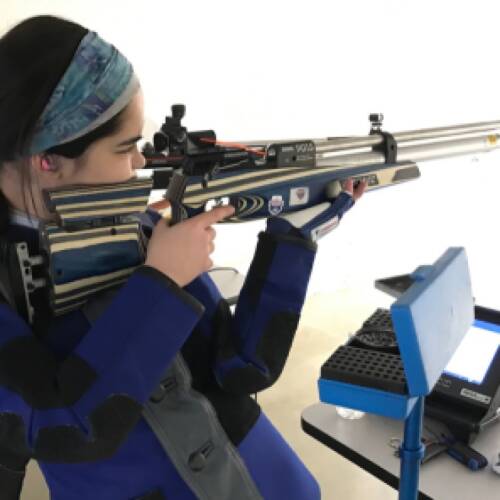 Rifle athlete, Aliah Lloyd, rests between shots in virtual competition.